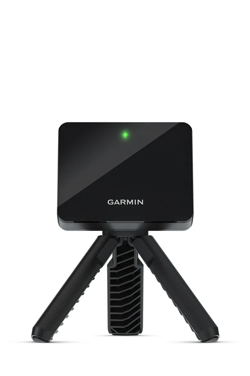 Garmin Approach R10 launch monitor in a home golf simulator setup